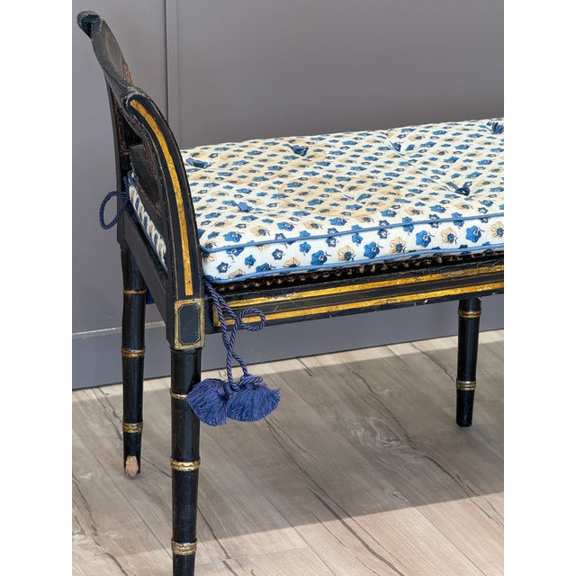 This English Regency period window bench features original black and gilt-painted surface with cane seat and ends, framed...