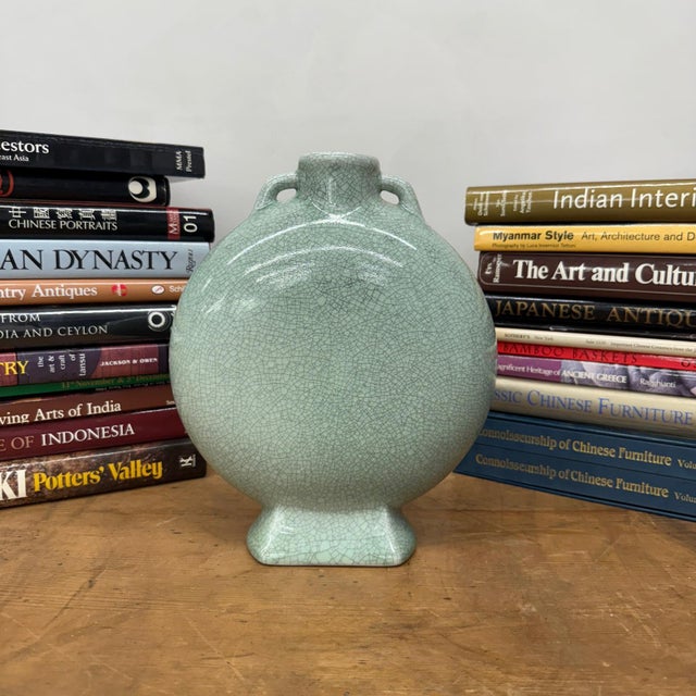 "About This Piece About This Piece This vase captures timeless elegance with its soft celadon glaze and intricate network...
