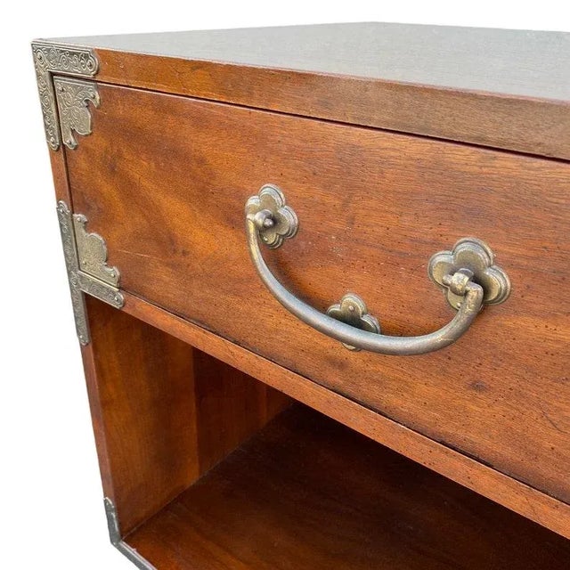 Vintage from the 1970s Materials: brass, wood Width: 22 inches Height: 23.5 inches Depth: 18 inches Genuine Henredon Tansu...