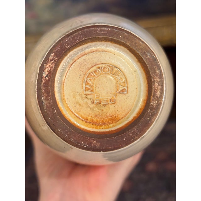 An elegant and highly collectible stoneware bottle vase designed by Suzanne Ramié for the renowned Atelier Madoura in...