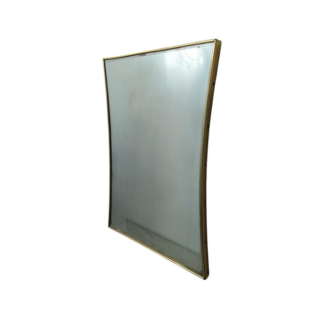 This modern antique mirror stands out for its refined and elegant hourglass shape, characterized by gently concave sides...