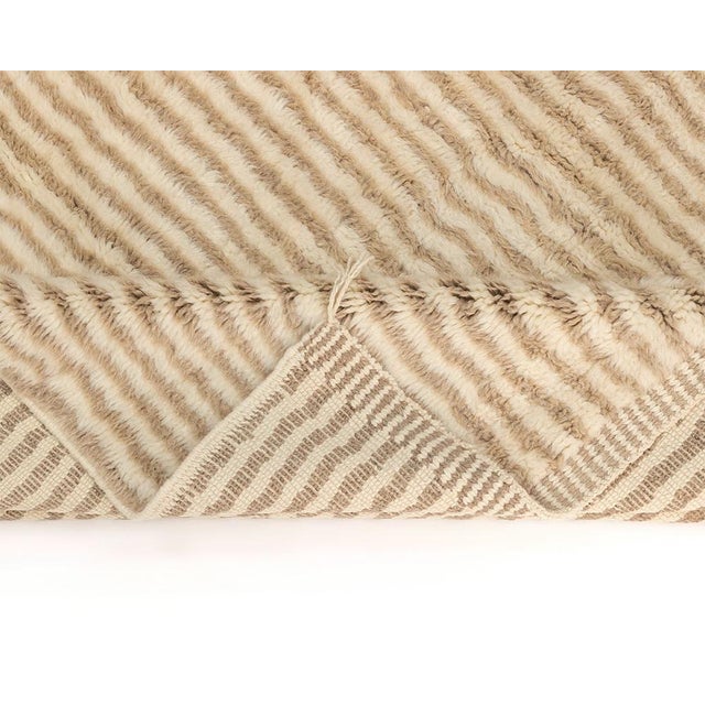 Elegant, hand-knotted wool rug with dual-tone Natural Wool and Misty Taupe stripes, offering a textured, plush feel,...
