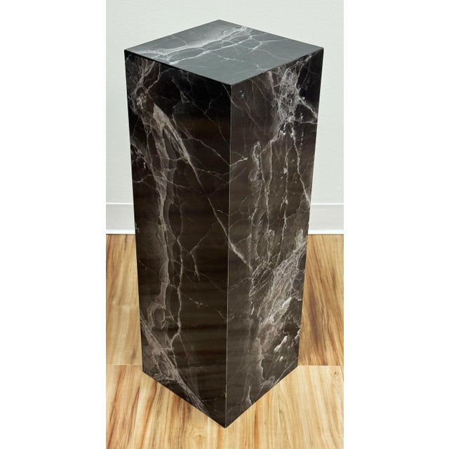 Vintage faux marble squared pedestal featuring dramatic black and white veining. Formica finish with a hollow wood core....