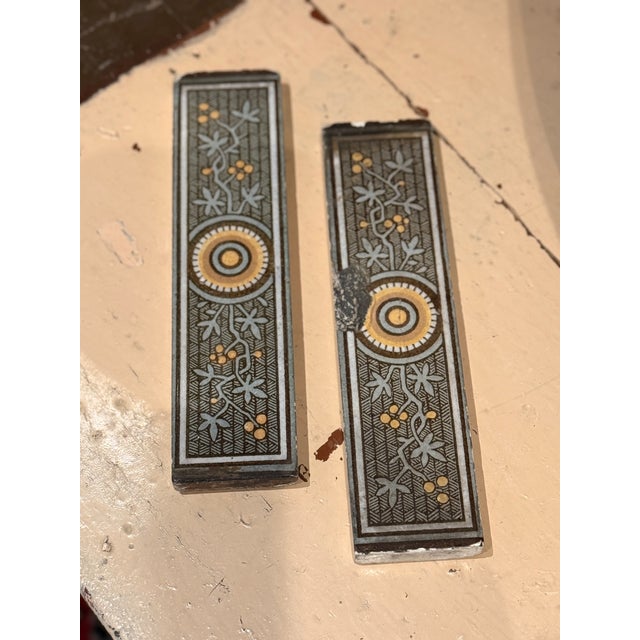 A striking group of 8 antique Victorian decorative tiles dating to circa 1880, featuring an elegant elongated form with...