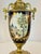 Elegantly inspired by the celebrated porcelain traditions of Sèvres, this vintage Italian decorative urn beautifully...