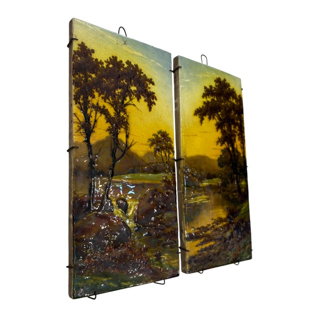A pair of decorative ceramic paintings, hand-painted in England in the late 19th century, depicting delicate river...