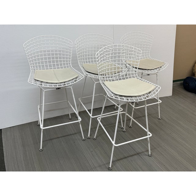 Design Plus Gallery presents a Set of Four Knoll Bertoia Counter Stools. The stools are produced by Knoll for Design...