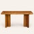 A substantial reclaimed wood console table, likely elm or fir, featuring a thick plank top joined with inset brass...
