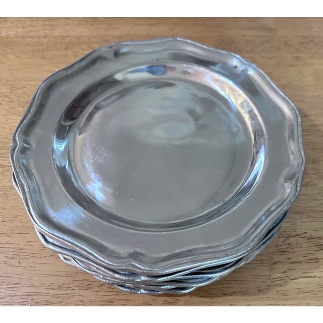 MidCentury pewter plates by Wilton Armetale Always in style specially during the holidays.