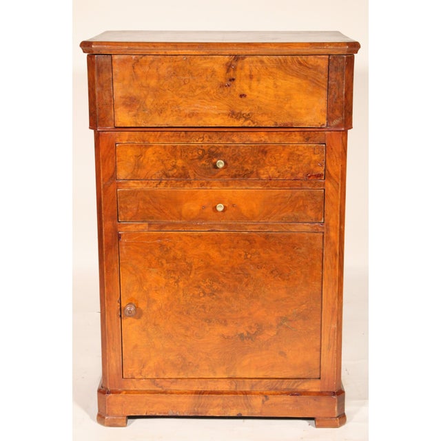 Louis Philippe burl walnut, burl elm and beech wood washstand / vanity, 19th century. With a burl walnut top that lifts...