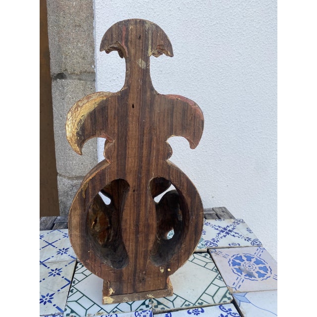 antique carved and gilded wooden architectural element, most likely part of a church altarpiece, altar, religious...