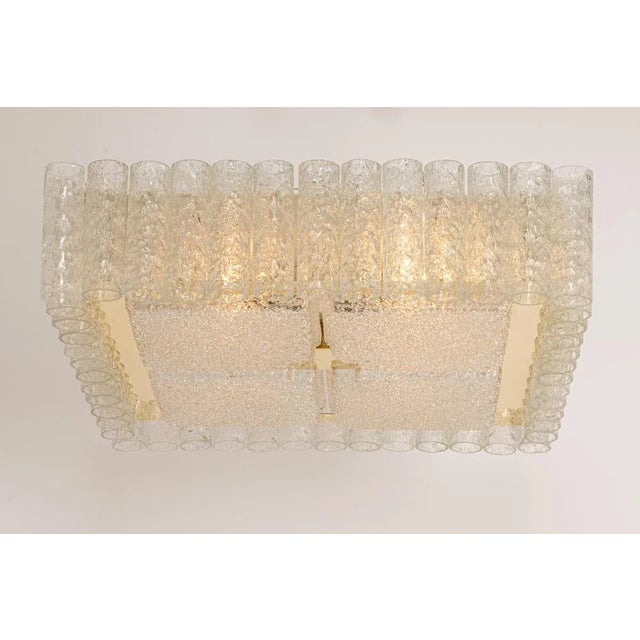 Large fantastic mid-century flush mount chandelier by doria, germany and manufactured circa 1960-1969. Many murano glass...