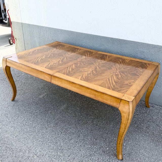 Fully extended: 123.5”, with one leaf measure: 101.5 This elegant French Provincial dining table by Century Furniture...