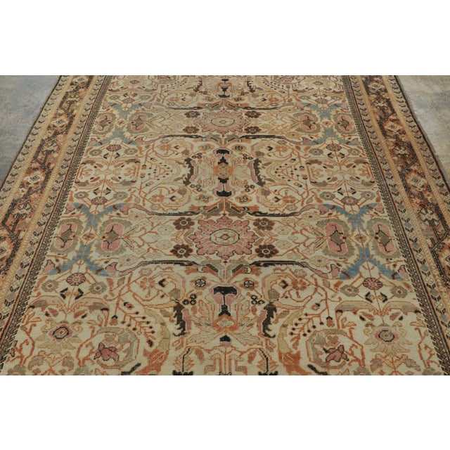 Hand-knotted in wool circa 1900-1920, this 7x11 antique Persian Mahal rug is a refined addition to Rug & Kilim’s...