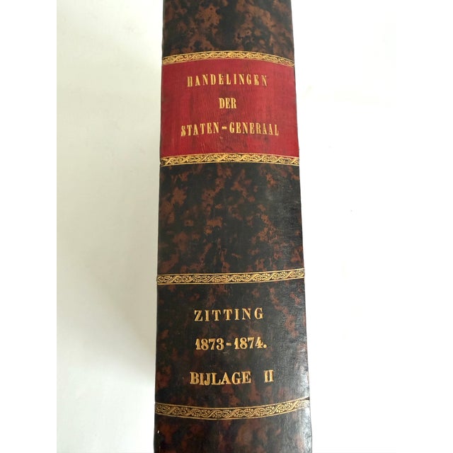 This oversized Dutch leather bound book is massive and beautiful with its marbleized cover. Translates to "Proceedings of...