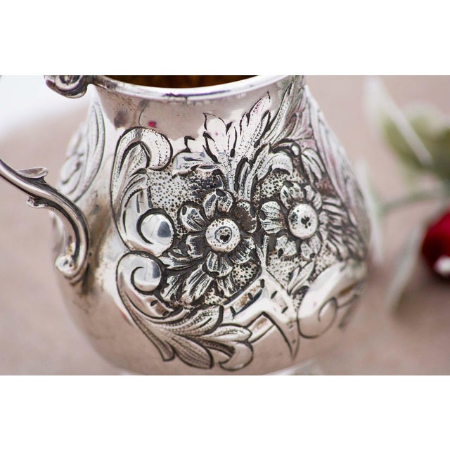 Silver Pot with Raised Floral Motifs Surrounding Monogram Card and Question Mark Handle, in Good conditions. Designed 1920...