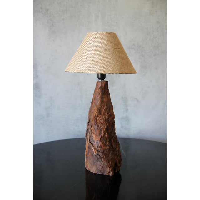 An extraordinary tree trunk lamp, meticulously handcrafted from stunning Brazilian wood showcases nature's artistry. This...