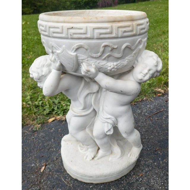 We are selling this beautiful and charming carved marble planter. This Italian white marble planter is carved with three...