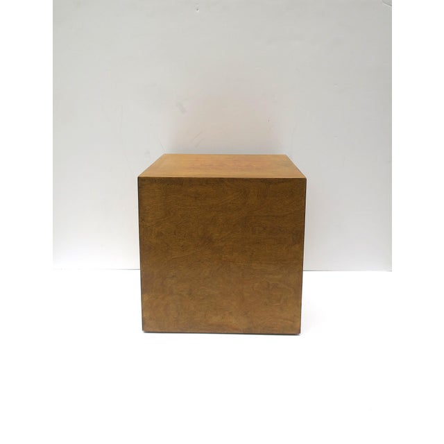 A beautiful wood veneered pedestal cube end table, in the Modern design style or Midcentury Modern design period, circa...