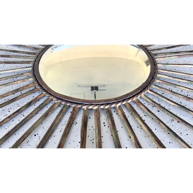 All metal, hand-made, sunburst convex mirror. With a total diameter of 60", it is the perfect accent for a big-scale room....
