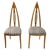 A pair of American distinctive high-back chairs with an elongated, pointed backrest design by John Turano & Sons. The...