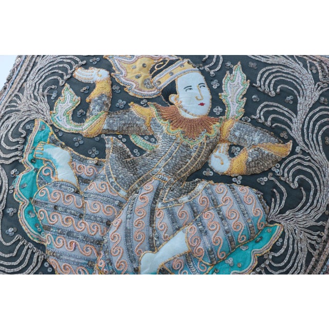 This pillow was crafted from an original vintage Kalaga tapestry. The back is finished in what appears to be ice pink raw...