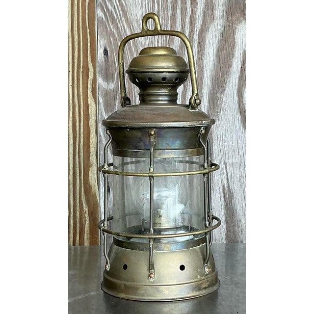 Presenting our Vintage Brass Ship's Lantern, a stunning piece that captures the spirit of American nautical heritage....