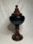 Rich colors of chestnut brown and ebony black adorn this crackled glazed ceramic urn. It's large size is impactful with a...