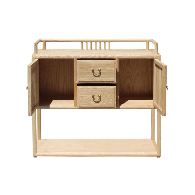 This is a simple clean Zen minimalistic oriental raw wood side table cabinet. There are small drawers, open storage. The...