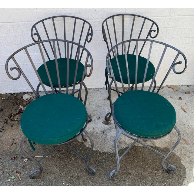 1960s Vintage Painted Wrought Iron Garden Chairs, Set of 4. Included are four seat cushions upholstered in green outdoor...