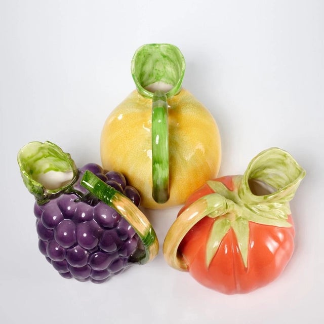 Charming and collectible 3-piece ceramic carafe lot by Haldon Group, featuring beautifully detailed grape, lemon, and...