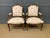 A charming pair of early 20th century French walnut armchairs, or fauteuils. Well constructed in solid walnut and...