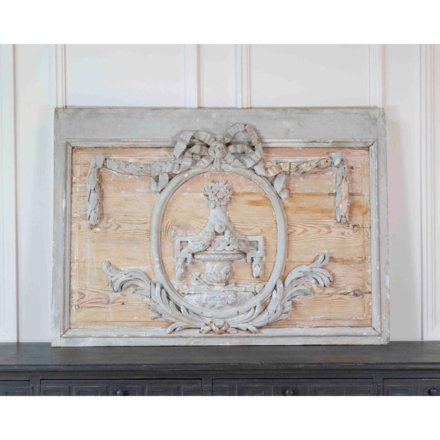 A beautiful late 18th to early 19th century French carved wooden boiserie panel featuring elegant neoclassical...