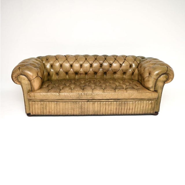 A smart and extremely well made antique deep buttoned leather Chesterfield sofa. This was made in England, it dates from...