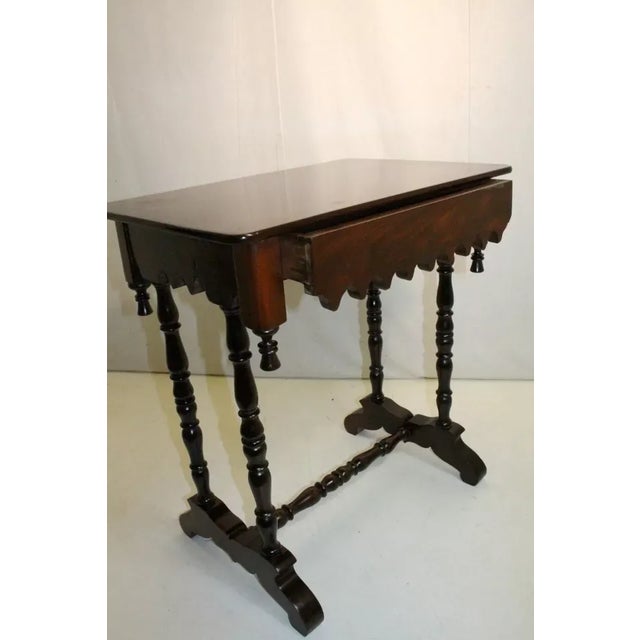 Great early American gothic style table made of mahogany featuring a rectangular top with a shaped apron and one drawer...