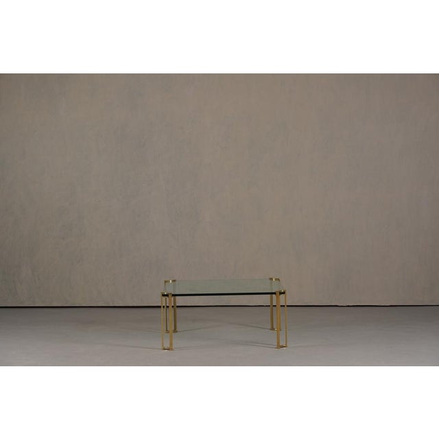 A rare vintage coffee table designed by Peter Ghyczy in Germany during the 1970's. This square table features solid bronze...
