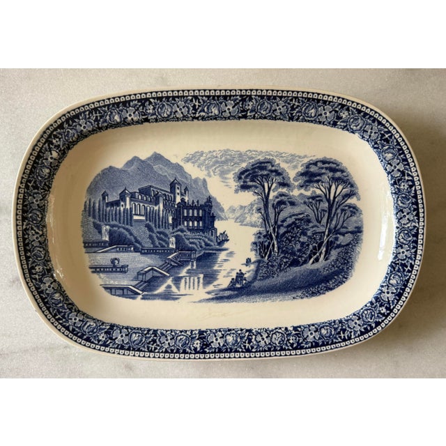 Set of 5 vintage blue and white transferware oval dinner plates in the "Old England Cambridge Blue" pattern featuring a...