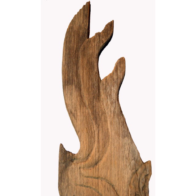 A 19th century Thai hand-carved wooden temple dragon sculpture mounted on a custom base. Born in Thailand during the 19th...