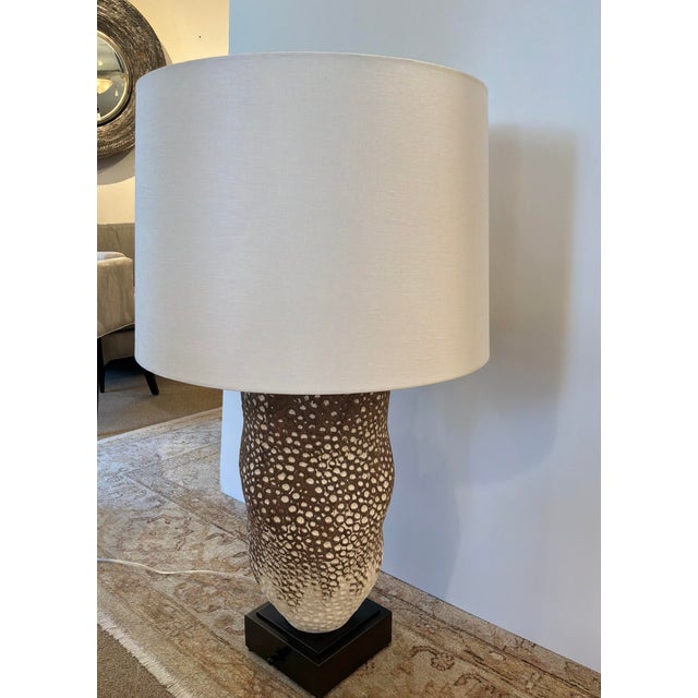 Stylish Revelation Moonscape Table Lamp. Sculptural textured body, organic form with natural brown and white finish....