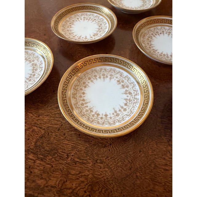 Gold rimmed with a Greek Key band, these handsome little Limoges dishes are smaller than a butter plate, yet deep enough...