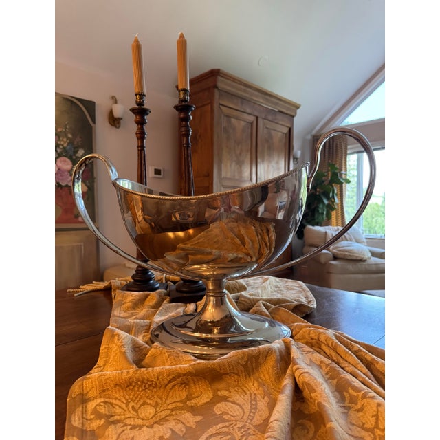 Striking oversized decorative bowl by Global Views featuring an elegant sculptural silhouette with dramatic oversized...