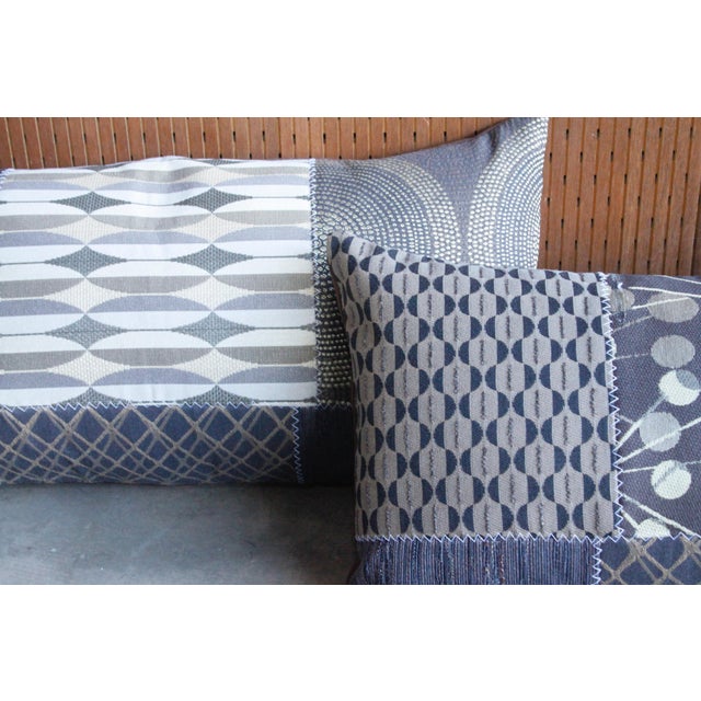 Individual swatches, which have been castaway from the architectural/interiors industry, are selected to create a...