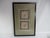Vintage black wood framed pair of Chinese silk embroidery gold panels, decorated with floral designs in colors of green...