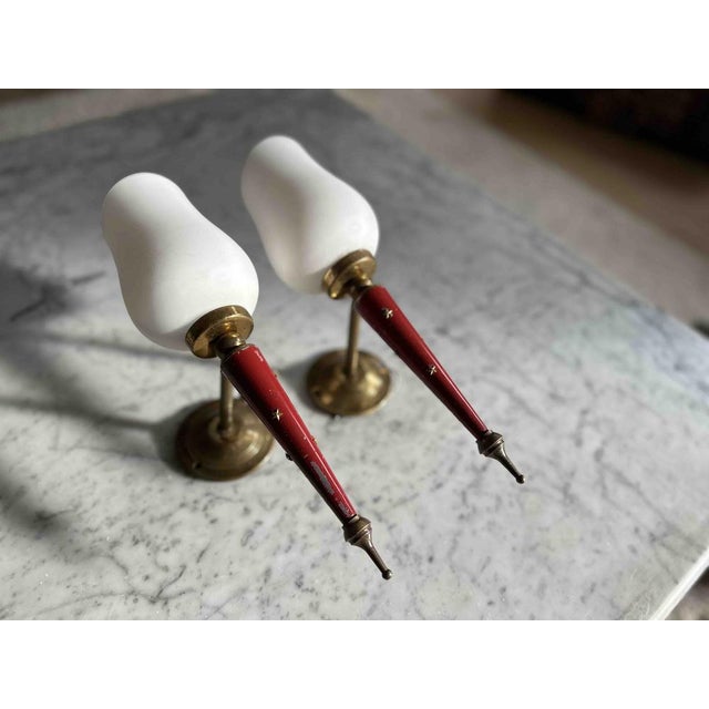 Immerse your space in the charm of these neoclassical wall sconces, reminiscent of the style of Maison Arlus. This pair of...