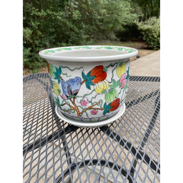 A lovely glazed porcelain Cachepot/Planter/Jardiniere in the Famille Rose tradition with matching drain plate. Circa...