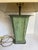 Here is a sophisticated vintage table lamp featuring a sculptural, geometric base with an angular form and a verdigris-...