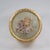 This is beautiful gilt metal box featuring a petit point floral spray under a convex glass top. A charming collector’s...