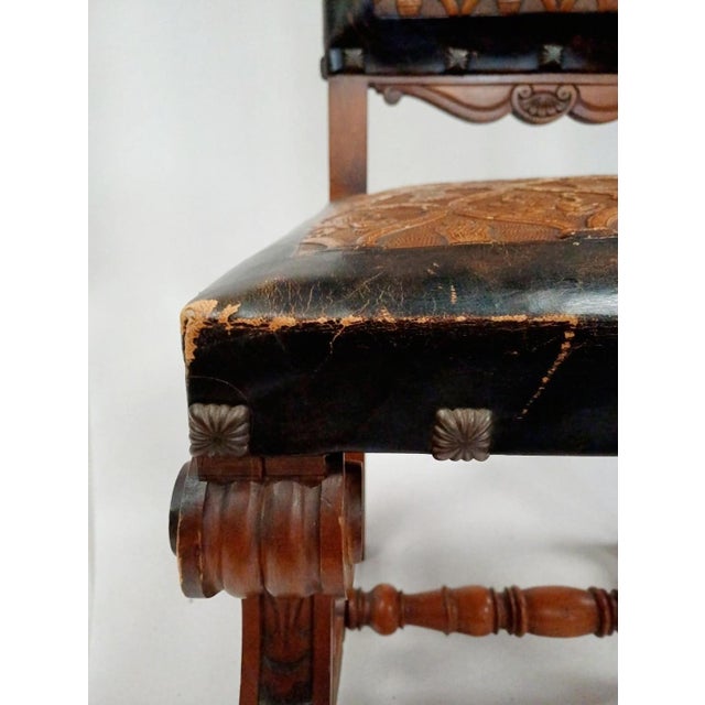 This striking antique Spanish Chair is a powerful example of late 19th-century castilian craftsmanship, combining richly...