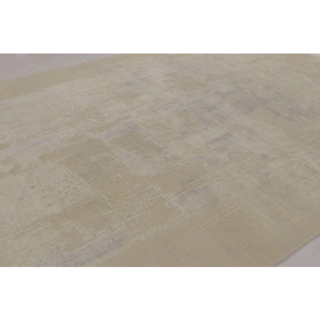Hand-knotted in wool and silk, this 10x14 contemporary abstract rug is the latest addition to Rug & Kilim’s Modern...