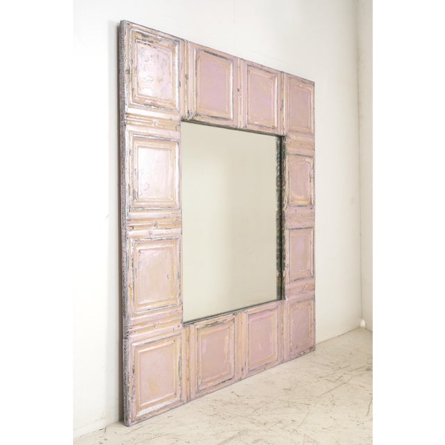 This one of kind wall mirror was made using antique 100 year old tin ceiling tiles painted a pale metallic pink. This...
